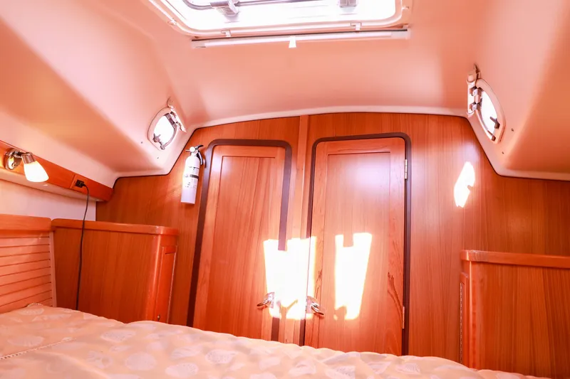 Slide: The Image of Interior cabin of a 2010 Catalina 375 sailboat with wooden finishes and natural light. - 47