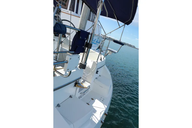 Slide: The Image of Sailboat Catalina 375, 2010 model, docked with blue canopy and ocean view. - 5