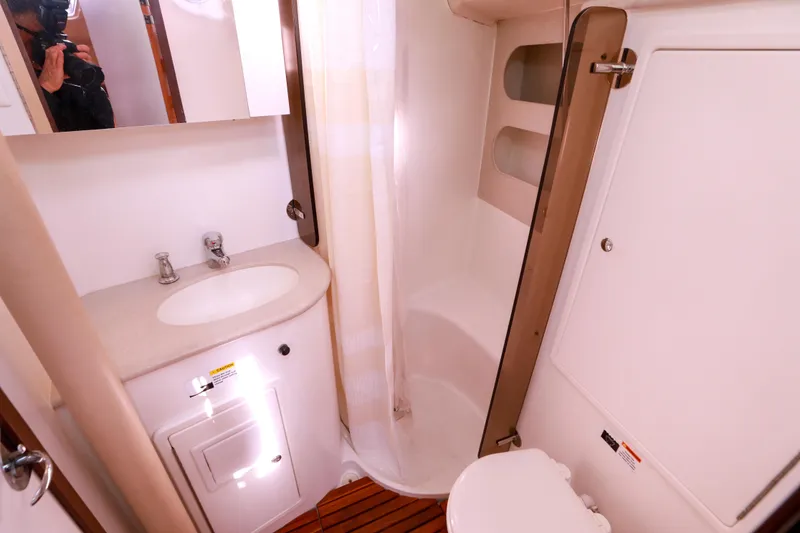 Slide: The Image of Bathroom interior of a 2010 Catalina 375 yacht, featuring sink, shower, and toilet. - 50