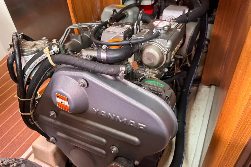 Slide: The Image of Engine compartment of a 2010 Catalina 375 sailboat featuring a Yanmar engine. - 56