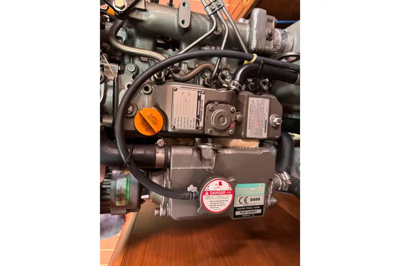 Slide: The Image of Engine of a 2010 Catalina 375 sailboat, showcasing detailed mechanical components. - 57