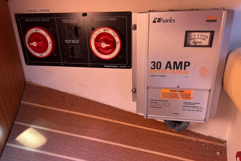 Slide: The Image of Battery control panel and 30 AMP charger on a 2010 Catalina 375 sailboat. - 59