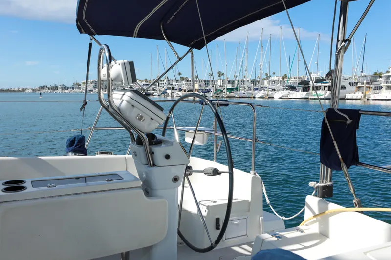 Slide: The Image of Cockpit view of 2010 Catalina 375 sailboat in a marina with clear blue skies. - 6