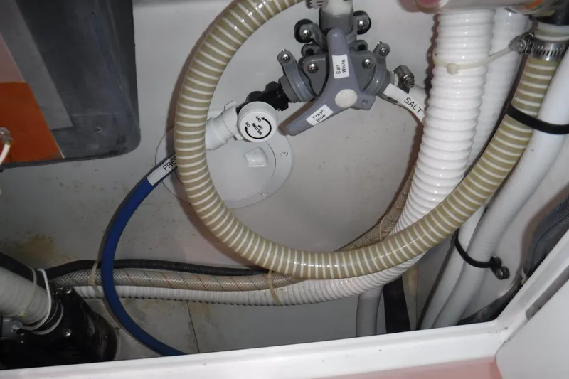 Slide: The Image of Plumbing system of a 2010 Catalina 375 yacht, featuring hoses and valves. - 63