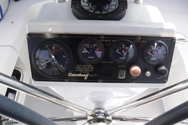 Slide: The Image of Control panel of a 2010 Catalina 375 yacht with gauges and controls. - 64