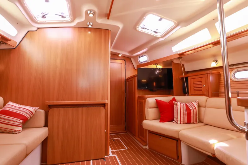 Slide: The Image of Interior of 2010 Catalina 375 sailboat with cozy seating and wooden finishes. - 65