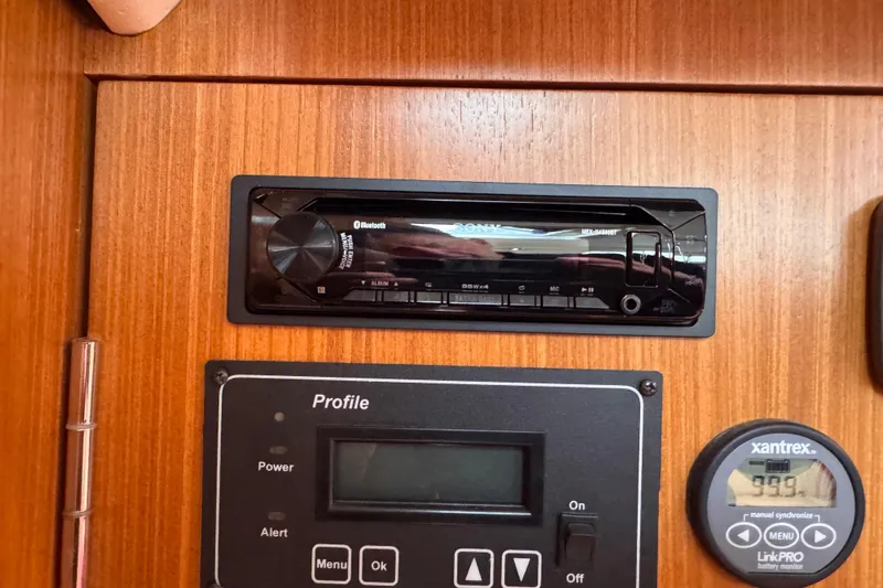 Slide: The Image of Control panel with Sony stereo and Xantrex display on 2010 Catalina 375 yacht. - 69