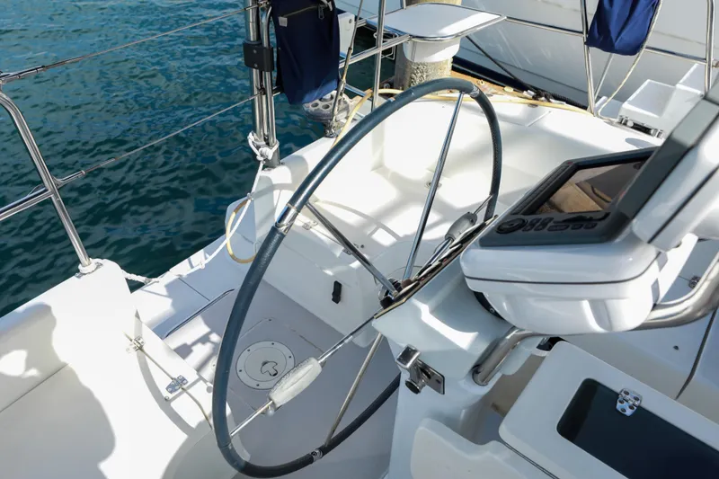 Slide: The Image of Cockpit of a 2010 Catalina 375 sailboat with steering wheel and navigation equipment. - 7