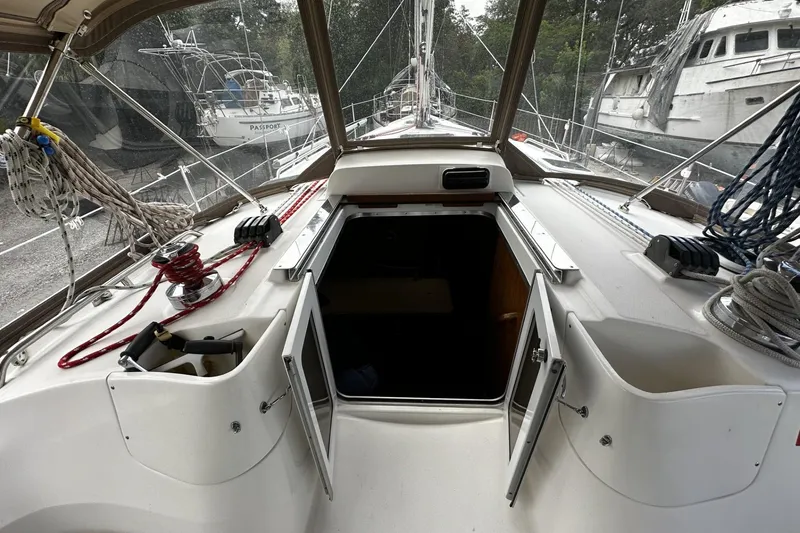 Slide: The Image of 2004 Hunter 41 Aft Cockpit sailboat interior with open hatch and rigging. - 12