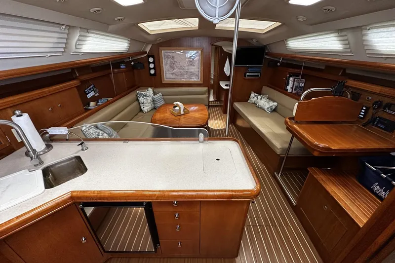 Slide: The Image of Interior of 2004 Hunter 41 Aft Cockpit sailboat with wood finish and modern amenities. - 13