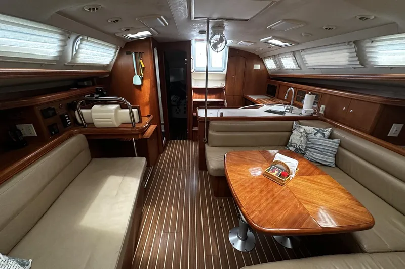 Slide: The Image of Interior of 2004 Hunter 41 Aft Cockpit yacht with wood finishes and seating area. - 14