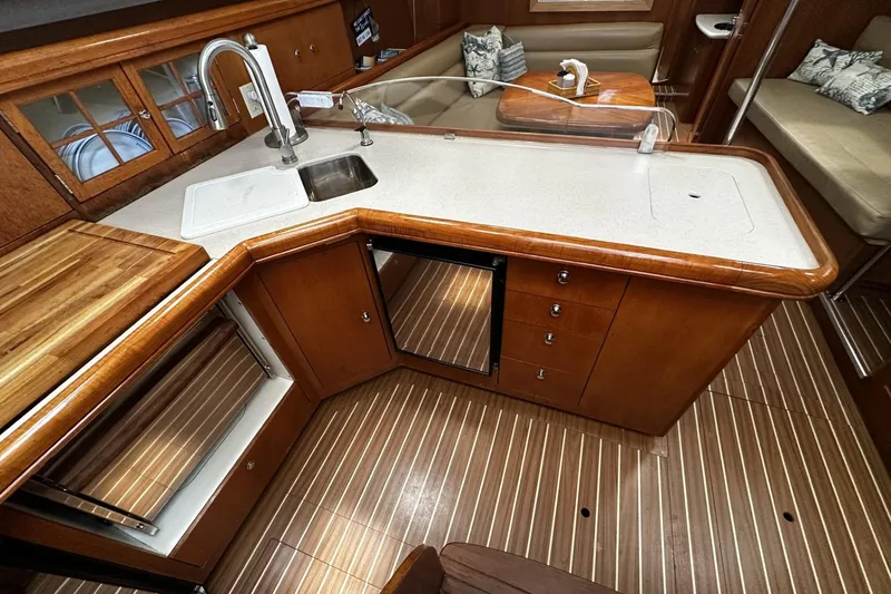 Slide: The Image of Luxurious 2004 Hunter 41 Aft Cockpit yacht interior with modern kitchen amenities. - 18