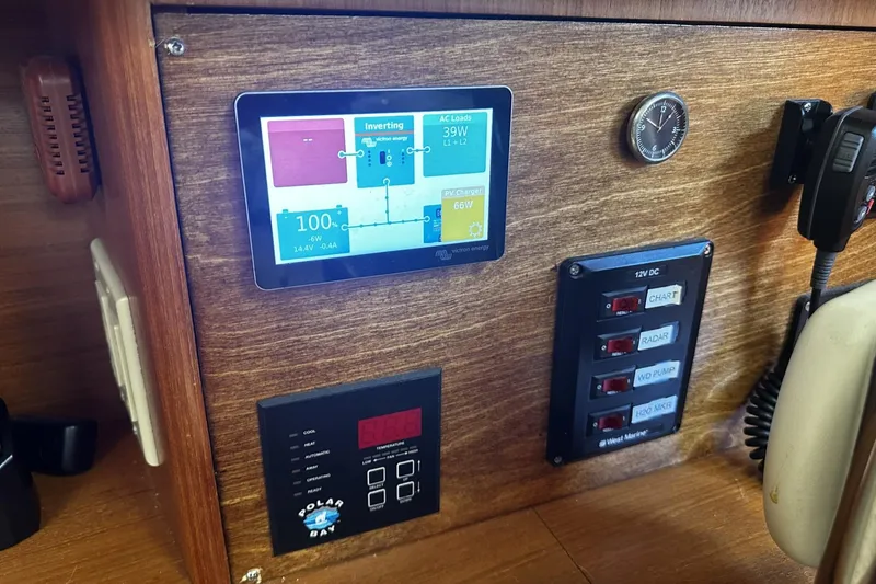 Slide: The Image of Control panel of a 2004 Hunter 41 Aft Cockpit sailboat with digital display. - 23