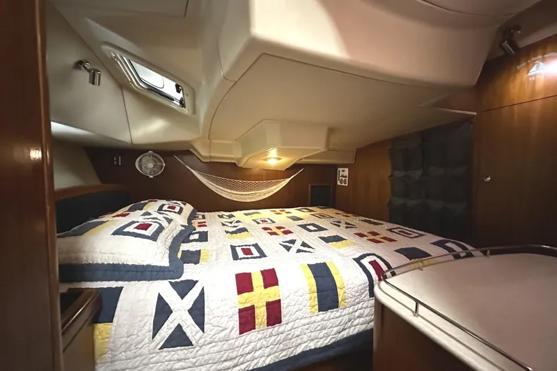 Slide: The Image of Interior of a 2004 Hunter 41 Aft Cockpit yacht with cozy bed. - 24