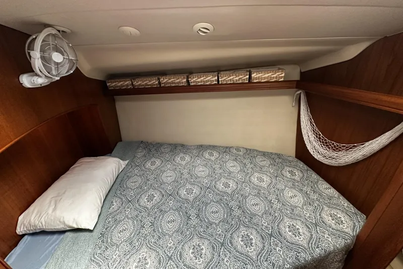 Slide: The Image of Cozy cabin interior of 2004 Hunter 41 Aft Cockpit yacht with bed and storage. - 29