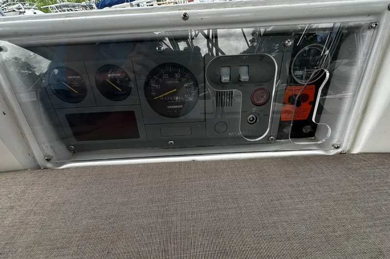 Slide: The Image of Control panel of a 2004 Hunter 41 Aft Cockpit sailboat with gauges and switches. - 37