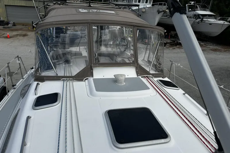 Slide: The Image of 2004 Hunter 41 Aft Cockpit sailboat with covered cockpit and visible deck details. - 4