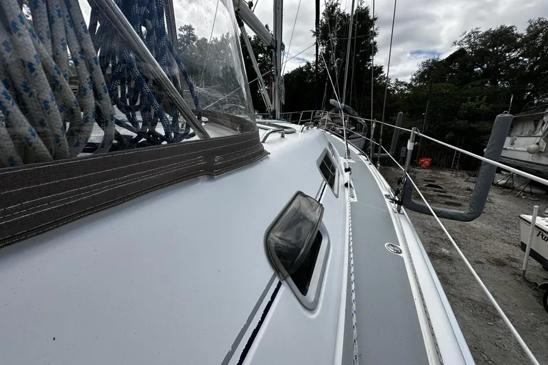 Slide: The Image of 2004 Hunter 41 Aft Cockpit sailboat deck with rigging and windows. - 46