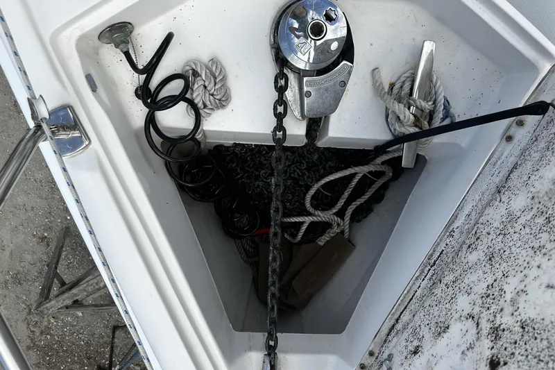 Slide: The Image of Anchor locker of 2004 Hunter 41 Aft Cockpit sailboat with ropes and chains. - 49
