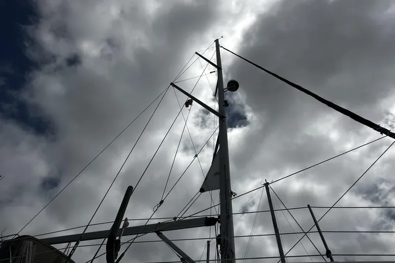 Slide: The Image of Sailboat mast of 2004 Hunter 41 Aft Cockpit against cloudy sky. - 52