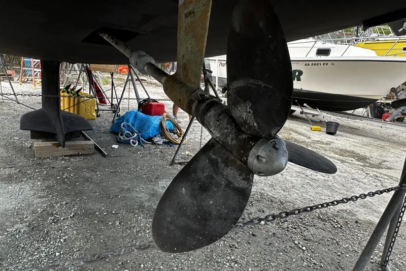 Slide: The Image of Propeller of a 2004 Hunter 41 Aft Cockpit sailboat in a boatyard setting. - 59