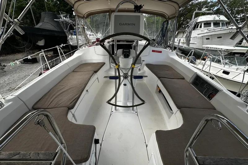 Slide: The Image of 2004 Hunter 41 Aft Cockpit sailboat with Garmin navigation, spacious seating, and sleek design. - 7