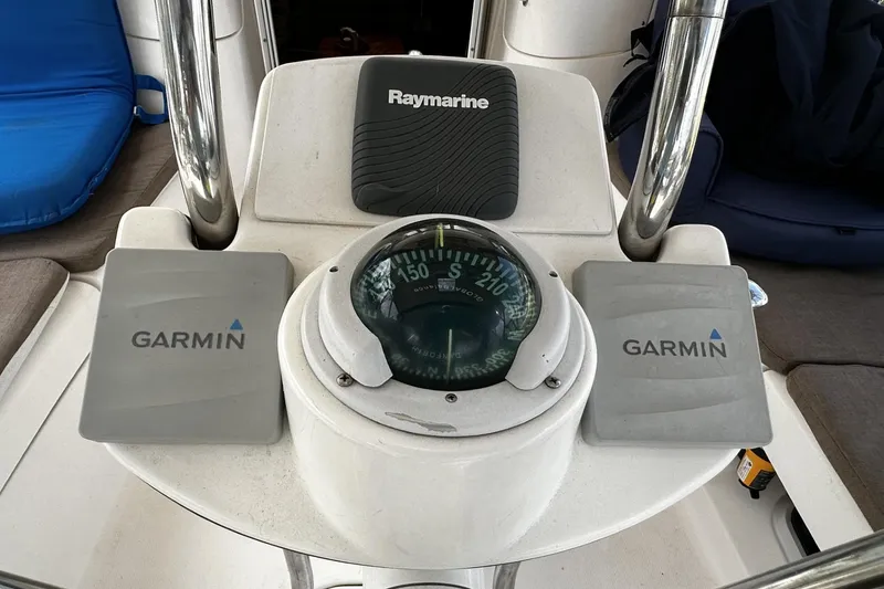 Slide: The Image of Cockpit of 2004 Hunter 41 Aft with Garmin and Raymarine navigation equipment. - 9