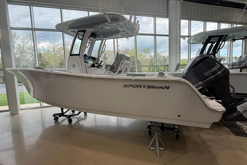 The Image of 2026 Sportsman Open 232 Center Console boat displayed indoors. - 0