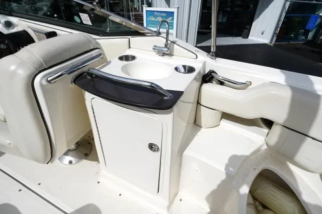 Slide: The Image of 2007 Sea Ray SLX 250 boat interior with sink and seating area. - 12