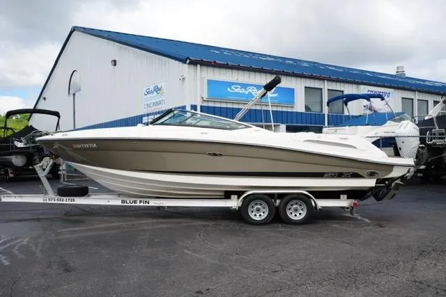 Slide: The Image of 2007 Sea Ray SLX 250 boat on trailer outside dealership. - 3