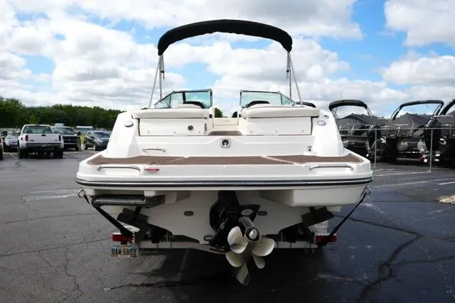 Slide: The Image of Rear view of a 2007 Sea Ray SLX 250 boat in a parking lot. - 6
