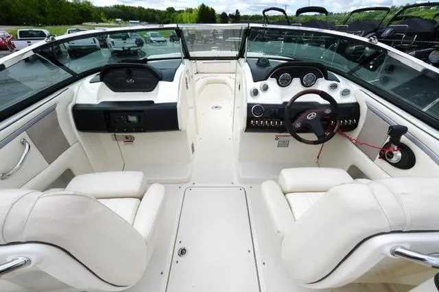 Slide: The Image of Interior view of a 2007 Sea Ray SLX 250 boat, featuring a sleek dashboard and comfortable seating. - 7