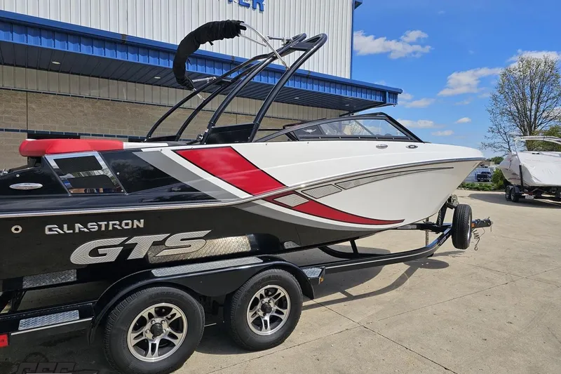Slide: The Image of 2020 Glastron GTS 225 boat on trailer, featuring sleek design and vibrant colors. - 10