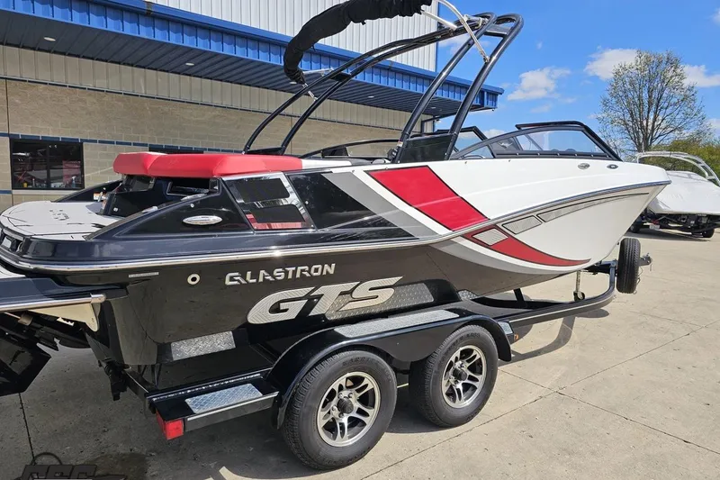 Slide: The Image of 2020 Glastron GTS 225 boat on trailer, featuring sleek design and vibrant colors. - 11