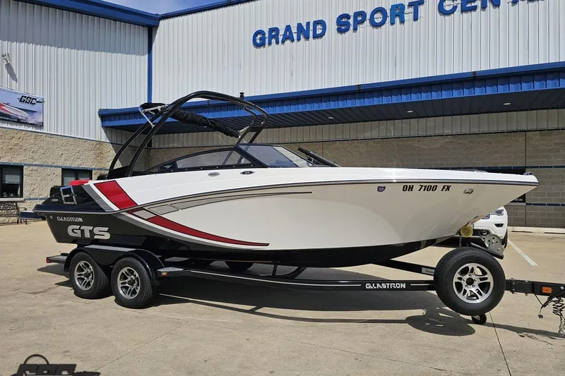Slide: The Image of 2020 Glastron GTS 225 boat on trailer outside Grand Sport Center. - 15