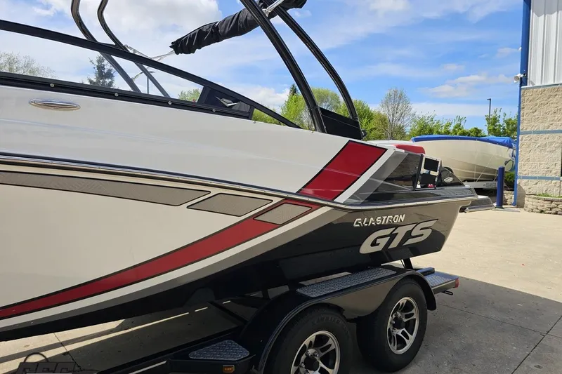 Slide: The Image of 2020 Glastron GTS 225 boat on trailer, featuring sleek design and vibrant colors. - 27