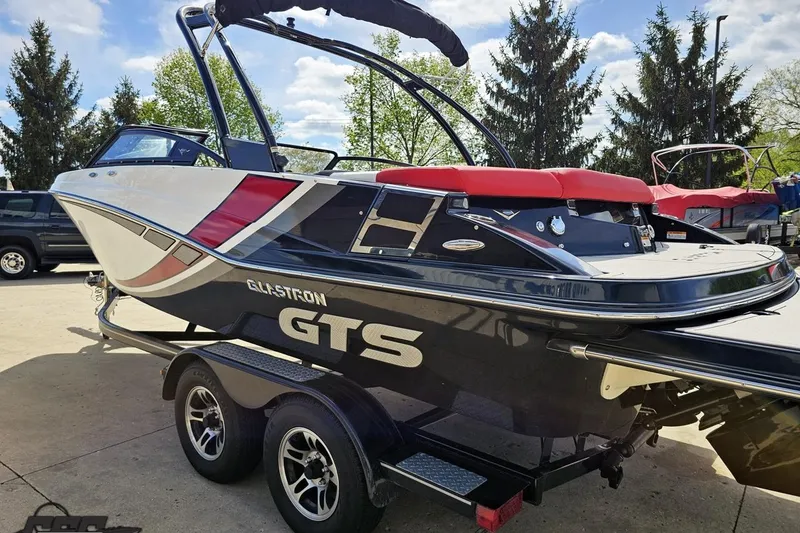 Slide: The Image of 2020 Glastron GTS 225 boat on trailer, featuring sleek design and vibrant colors. - 30