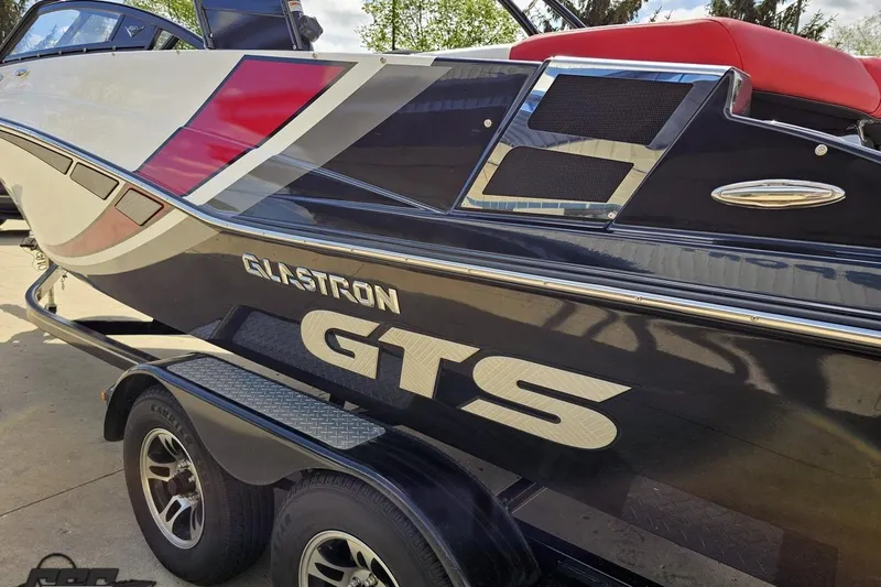 Slide: The Image of 2020 Glastron GTS 225 boat on trailer, featuring sleek design and vibrant colors. - 31