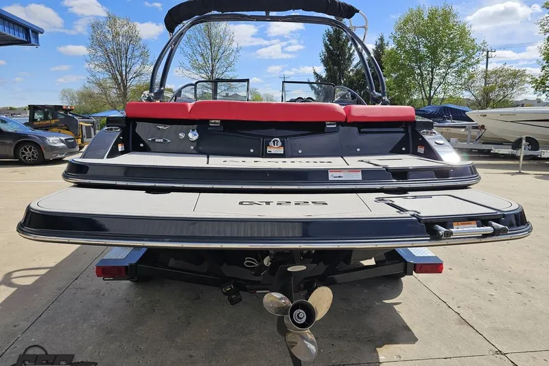 Slide: The Image of 2020 Glastron GTS 225 boat rear view with swim platform and propeller. - 34