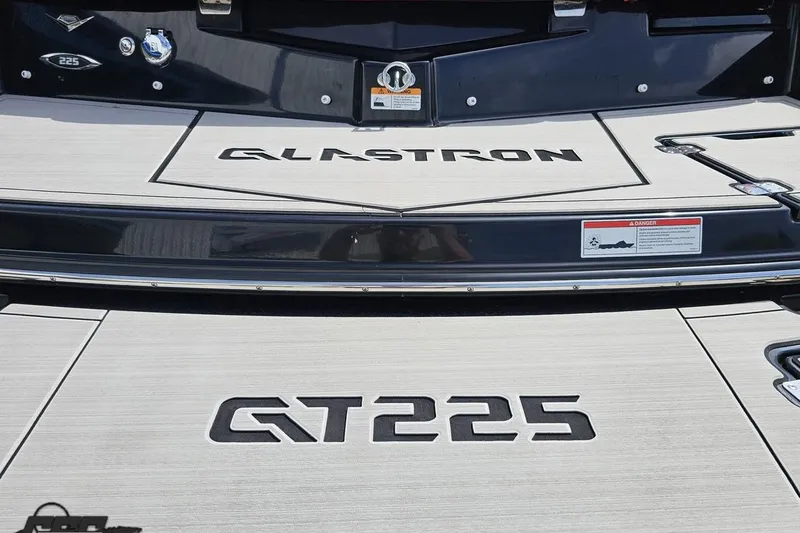 Slide: The Image of 2020 Glastron GTS 225 boat deck with branding and safety warning. - 39