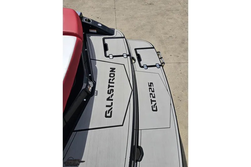 Slide: The Image of 2020 Glastron GTS 225 boat deck with logo and sleek design. - 40