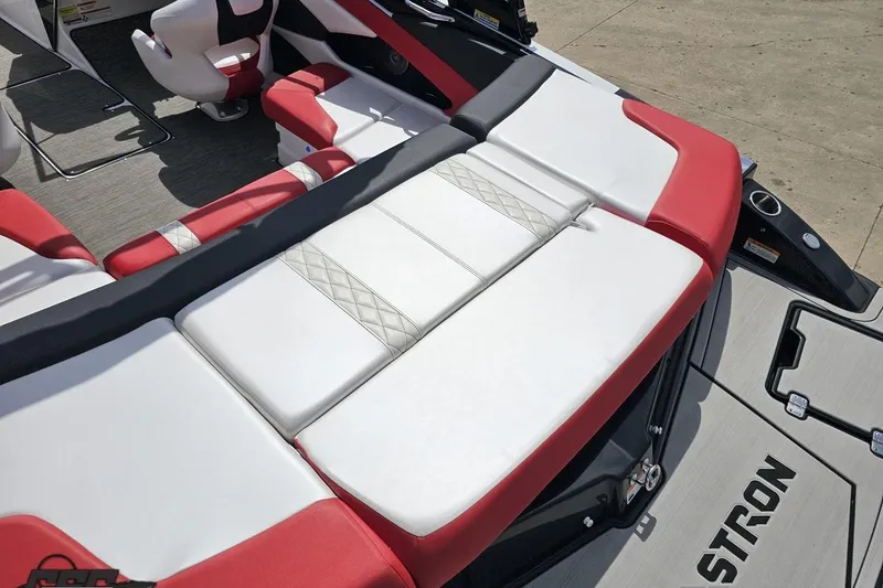 Slide: The Image of 2020 Glastron GTS 225 boat interior with red and white seating, showcasing modern design. - 41