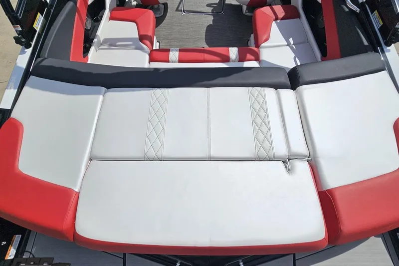 Slide: The Image of 2020 Glastron GTS 225 boat interior with red and white seating. - 44