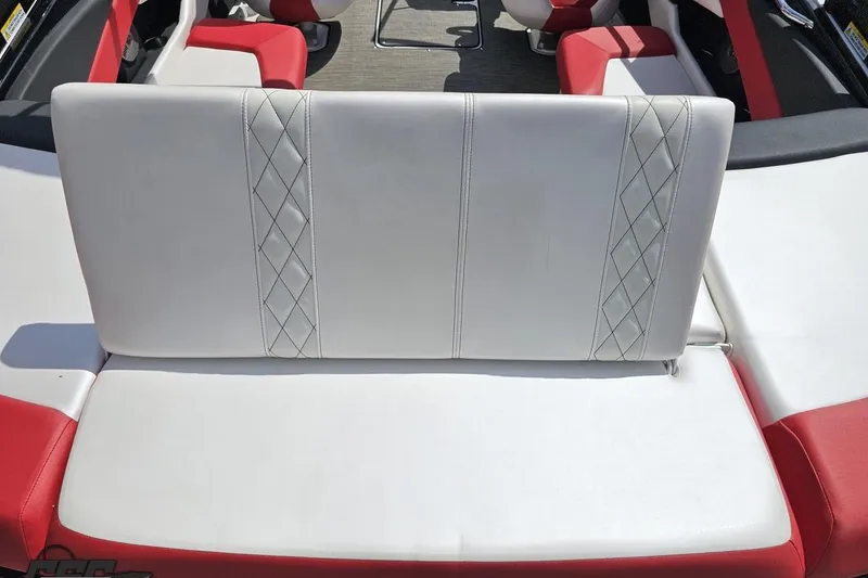 Slide: The Image of 2020 Glastron GTS 225 boat interior with white and red seating. - 45