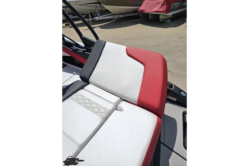 Slide: The Image of 2020 Glastron GTS 225 boat seat with red, white, and black upholstery design. - 46