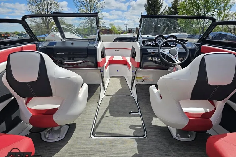 Slide: The Image of Interior of a 2020 Glastron GTS 225 boat with modern seating and dashboard. - 49