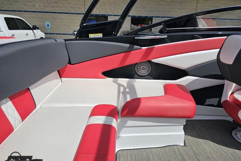 Slide: The Image of 2020 Glastron GTS 225 boat interior with red and white seating. - 53