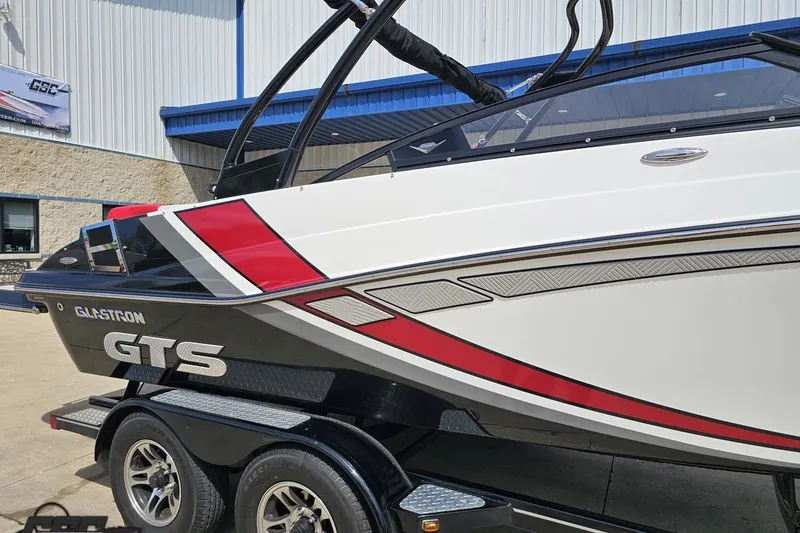 Slide: The Image of 2020 Glastron GTS 225 boat on trailer, featuring sleek design and vibrant colors. - 6