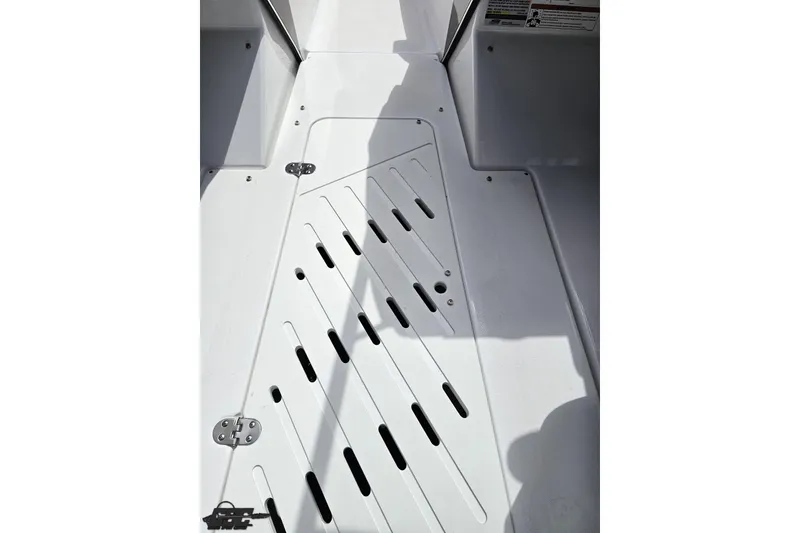 Slide: The Image of 2020 Glastron GTS 225 boat deck with white surface and drainage slots. - 61