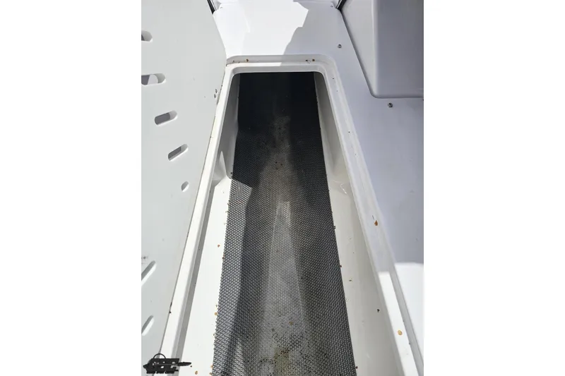 Slide: The Image of 2020 Glastron GTS 225 boat storage compartment with non-slip mat. - 62